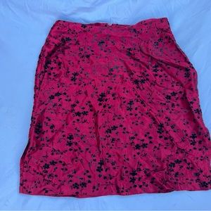 Red mini skirt with black velvet flowers